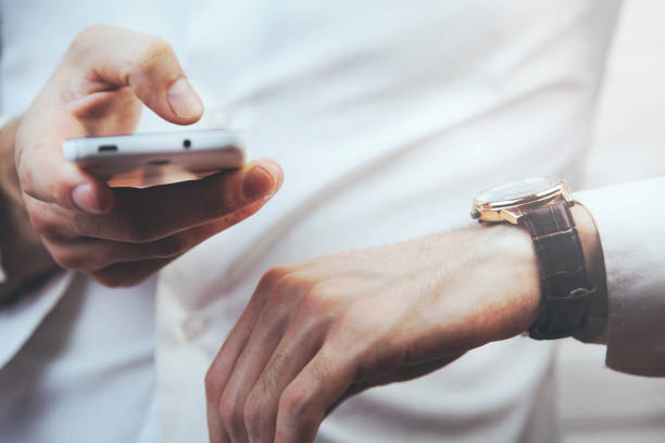 istock Man with Mobile phone connected to a smart watch 683274692