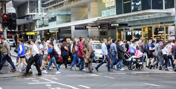 People crowd crossing street in central Sydney People crowd crossing street in central Sydney. zebra crossing photos stock pictures, royalty-free photos & images