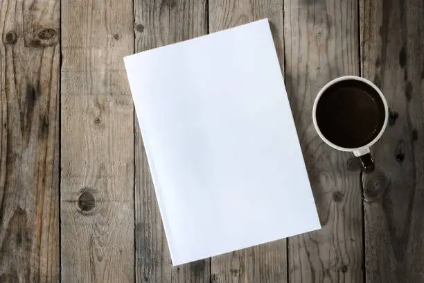 Photo of mock up on wood background with cup of coffee