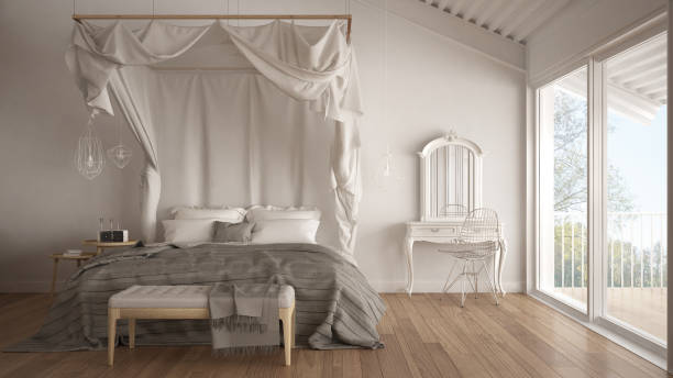istock Canopy bed in minimalistic white bedroom with big window, scandinavian classic interior design 683278188