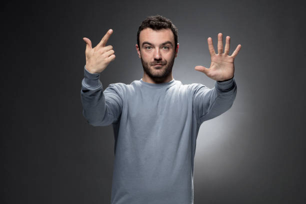 istock Young Man Showing Number Seven with Fingers. 683280404