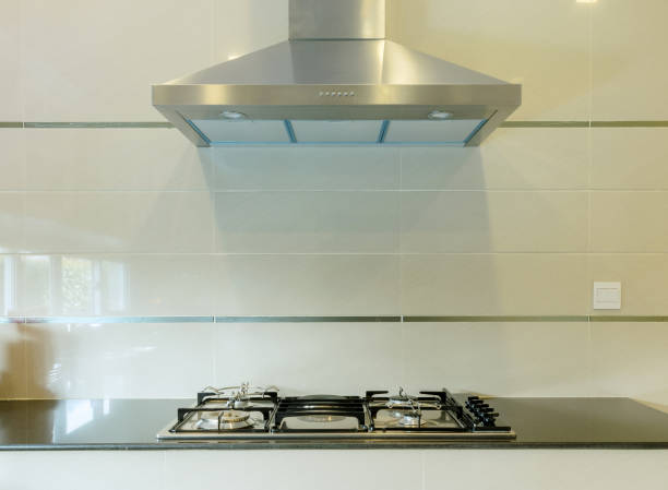 istock cooking gas stove with hood in modern kitchen 683286934