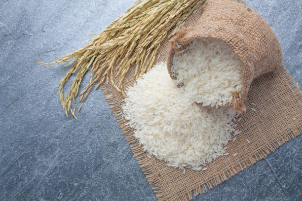 istock thai fragrant jasmine rice in a spoon with gold spike on Sack 683287170