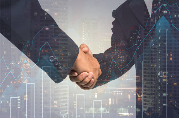 istock Double exposure handshake between businessman on cityscape and financial graph background, Business Trading concept 683293314