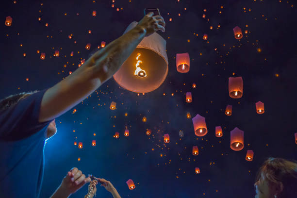Floating asian lanterns in the sky of Chiang Mai, Thailand Thailand, Asia, Night, Chiang Mai Province, selfie religious role stock pictures, royalty-free photos & images