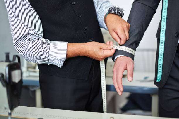 istock Tailor Taking Measurements in Atelier 683300310