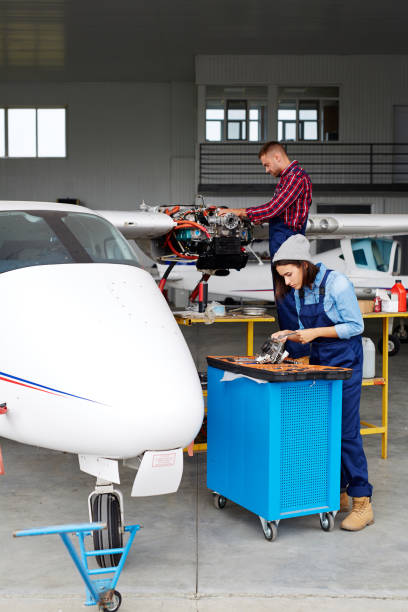 istock Aircraft Service Crew Repairing Jet Plane 683303888
