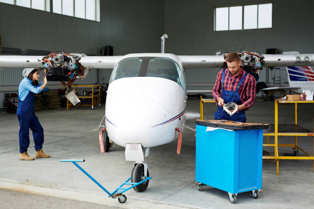 istock Airport Mechanics Fixing Plane 683303896