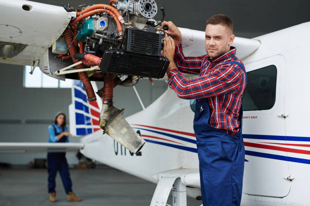 istock Airplane Engineers repairing Plane in Hangar 683303940