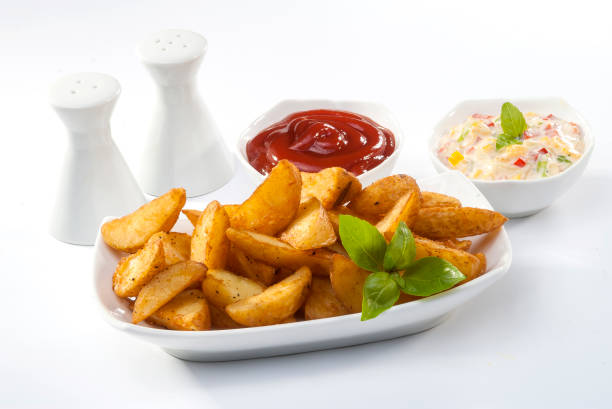istock Fried potato wedges with coleslaw & ketchup with basil leaf 683309612