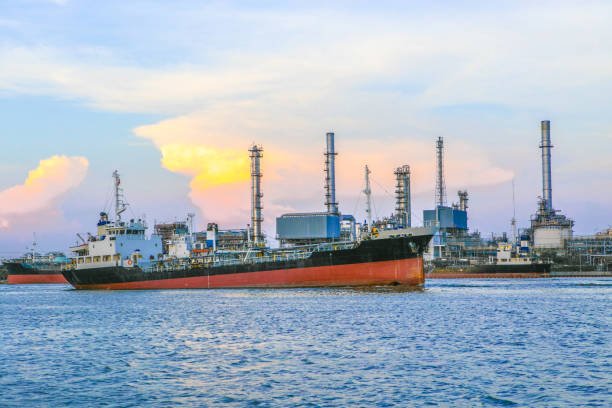 istock Industrial Container Cargo freight ship with working crane bridge in shipyard at dusk for Logistic Import Export background 683310844