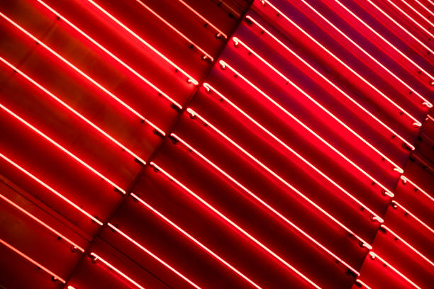 Bright red neon light metallic background. stock photo