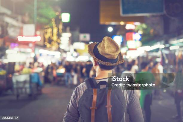 Young Asian Traveling Backpacker In Khaosan Road Night Market Stock Photo - Download Image Now