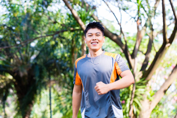 istock Asian man running in city park 683316356