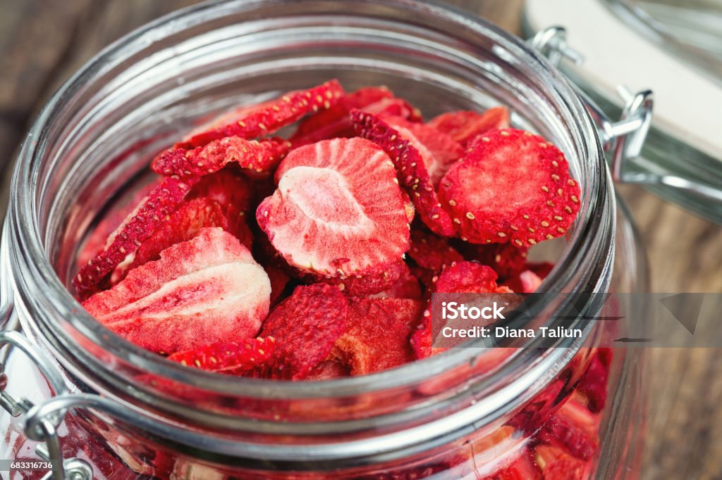 Dehydrated sliced strawberries in a glass jar Dehydrated sliced strawberries Dried Food Stock Photo