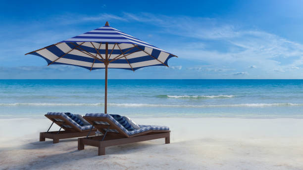 istock 3d blue and white umbrella on the beach 683332776