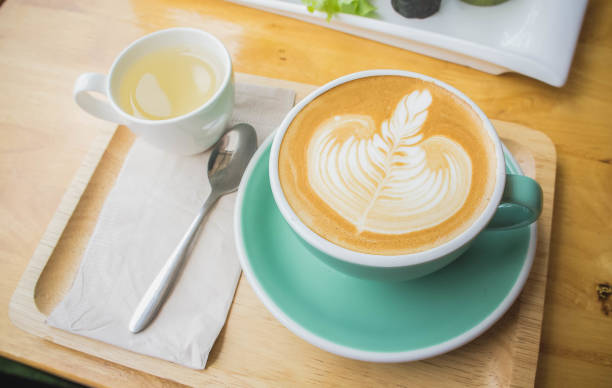 istock coffee cup on wood table in coffee shop 683333332