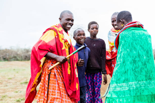 istock Massai family celebrating and dancing 683333584