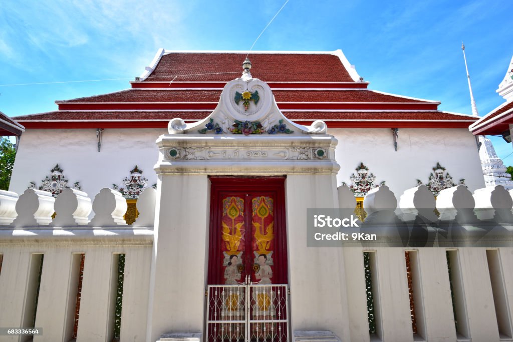 stucco flower stucco flower on the door of Buddhism church with blue sky Ancient Stock Photo