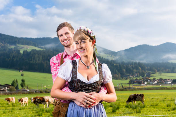 istock Alpine cattle farmers on mountain meadow 683340082