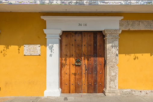 Cartagena: View at colonial entrance door with knocker in old historic part of Cartagena, Colombia