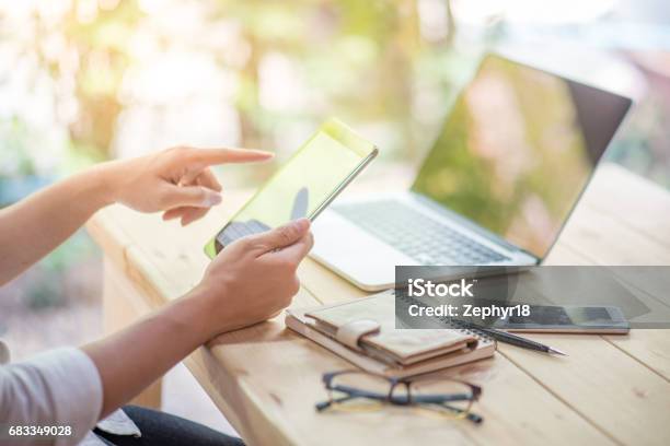 Business Man Holding Tablet And Working With Laptop And Smart Phone Stock Photo - Download Image Now