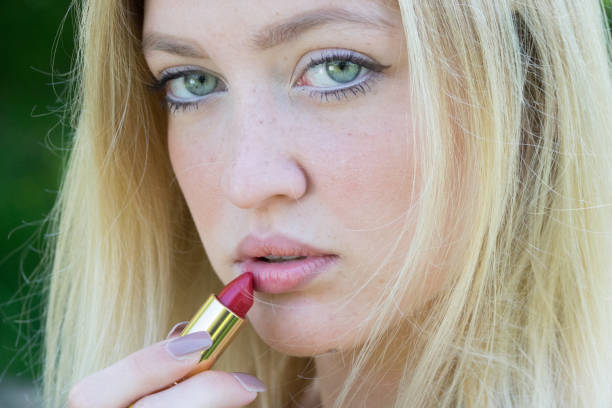 istock Beautiful blond young girl with red lipstick 683352448