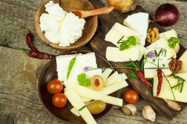 istock Sliced cheese and vegetables with chilli peppers. Aromatic food. 683352754