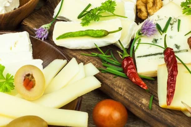 istock Sliced cheese and vegetables with chilli peppers. Aromatic food. 683352832