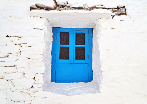 Cyclades architecture - traditional blue window at Sifnos island Greece