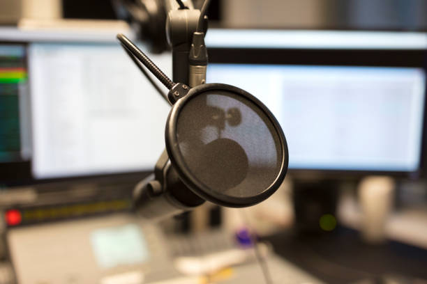 istock Close-up of a microphone in radio station broadcasting studio 683362124
