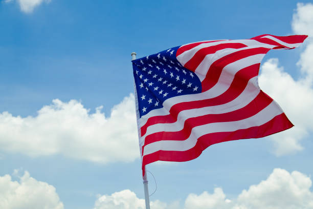 istock United States flag.have blue sky background. 683369324