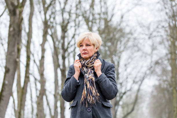 Depressed or sad woman walking in winter
