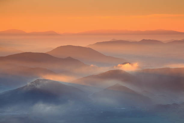 istock Beautiful sunrise over cloudy mountains 683382238