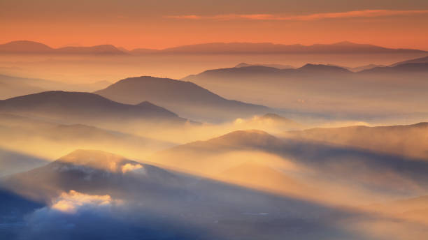 istock Beautiful sunrise over cloudy mountains 683382404