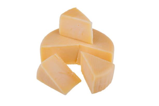 Yellow cheese wheel isolated on white background.