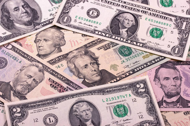 istock Abstract dollar bills of different denominations background. 683391634