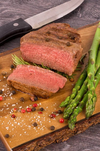 istock Close up on fillet mignon with asparagus on the side. 683392124
