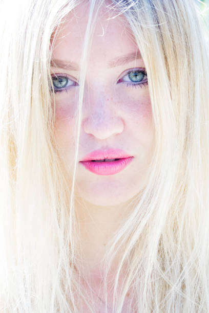 Beautiful sunny portrait of a blond girl with young blue eyes Beautiful sunny portrait of a blond girl with young blue eyes human body lice stock pictures, royalty-free photos & images