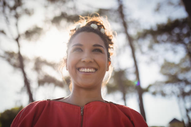 istock Low angle view of thoughtful smiling young woman 683401074