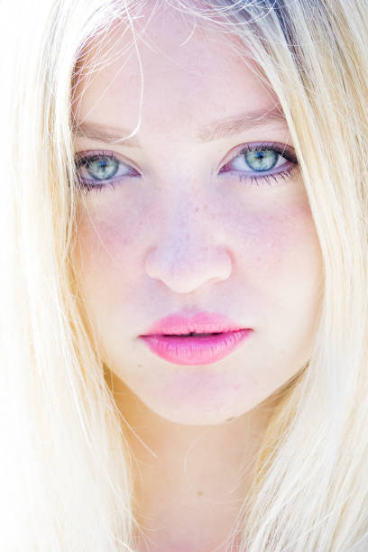 Beautiful sunny portrait of a blond girl with young blue eyes Beautiful sunny portrait of a blond girl with young blue eyes human body lice stock pictures, royalty-free photos & images