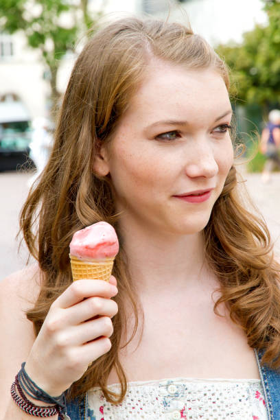 istock Young woman enjoy ice cream 683411084