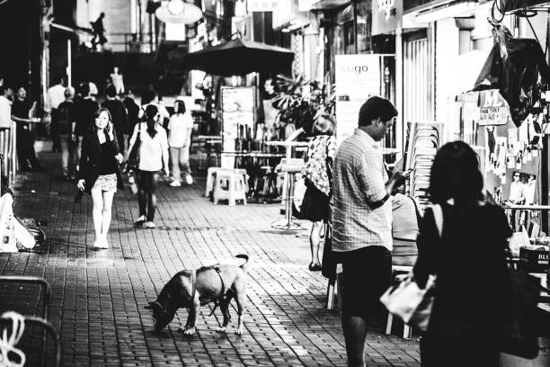 Hong Kong, Hong Kong S.A.R. - May 5, 2014: Everyday life in the streets of Hong Kong, people walking on sidewalk.
