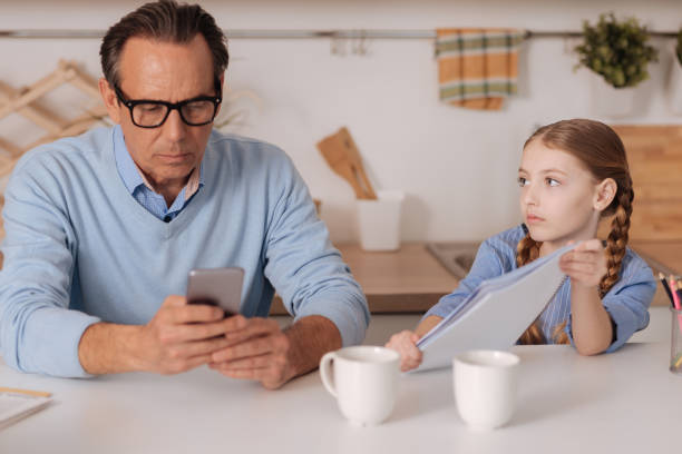 istock Indifferent businessman ignoring little kid at home 683412600