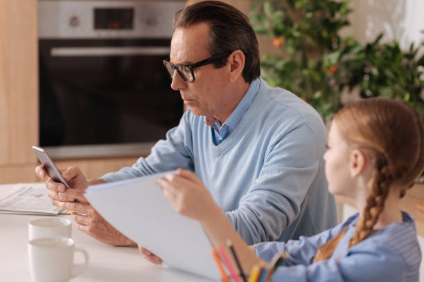 istock Apathetic pensioner ignoring kid at home 683412630