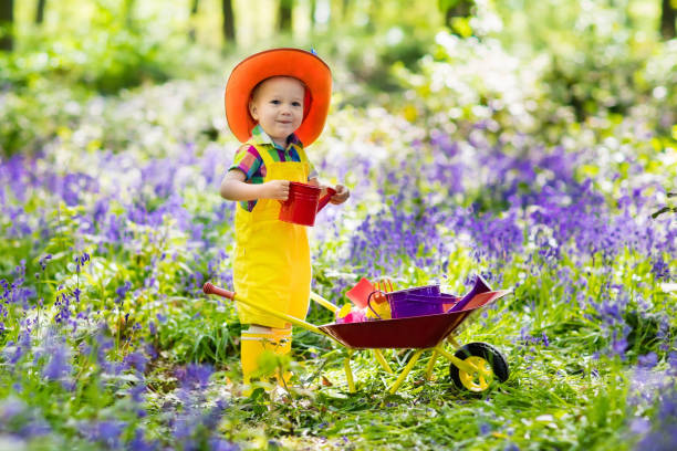 istock Kids in bluebell garden 683417812