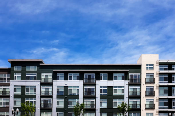 Modern apartment buildings on a sunny day with a blue sky stock photo