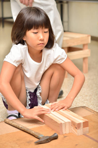istock Girl enjoying woodworking 683424076