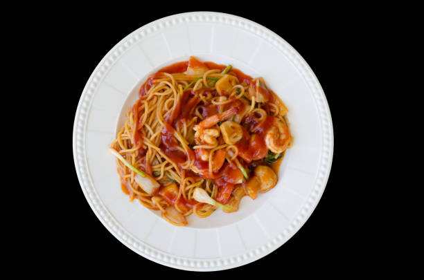 The spaghetti shrimp sauce isolated on black background