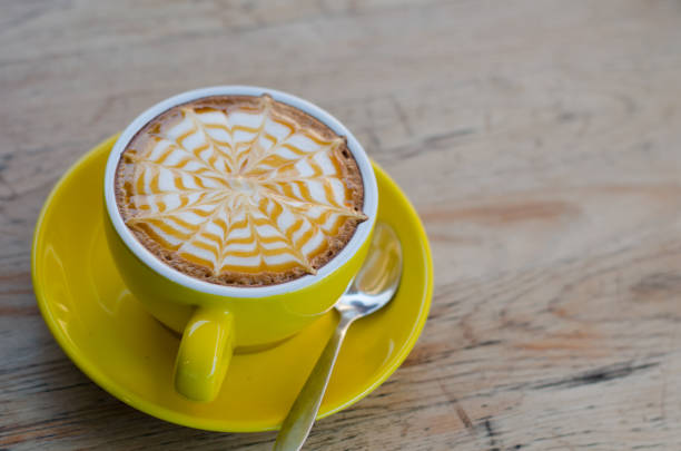 istock A Cup of hot latte art coffee on wooden table 683434794